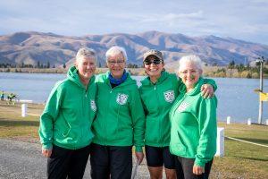Four women wearing green jackets at the Masters Rowing National Championships of New Zealand 2023.